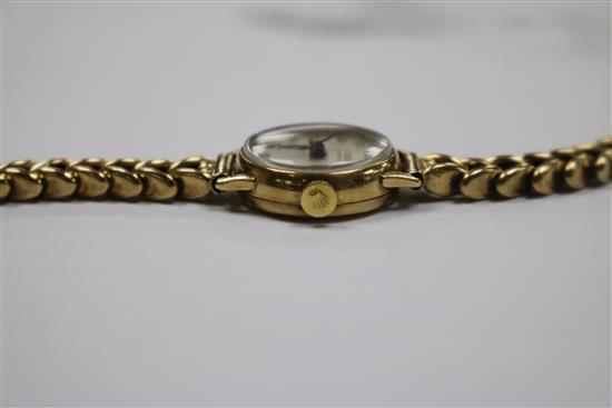 A ladys 1960s 9ct gold Tudor Royal manual wind wrist watch, on a 9ct gold bracelet.